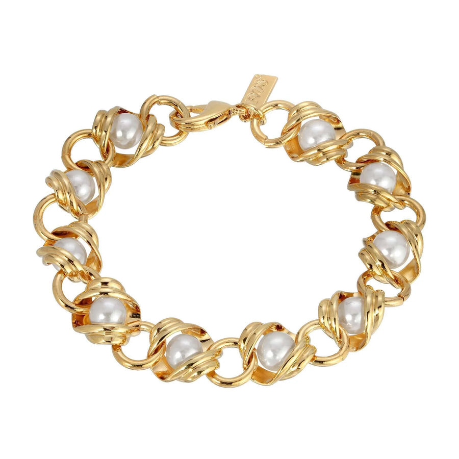 Luxe Pearl Link Chain Bracelet displayed on a textured neutral surface, featuring luminous faux pearls woven through gold-tone chain links for an elegant vintage-inspired look