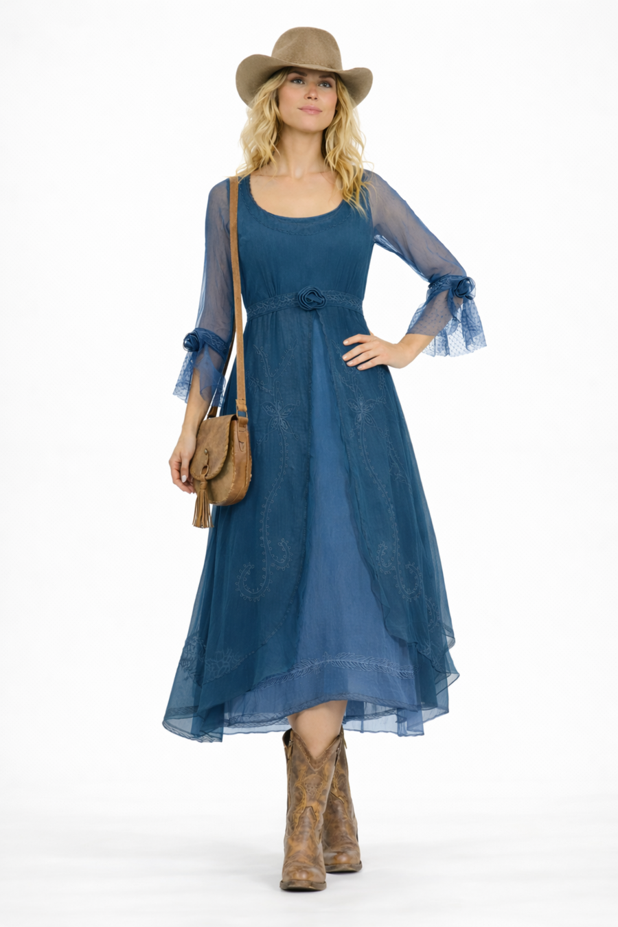 Model wearing the Dafna Western Romance Dress in Lapis Blue by Nataya with cowboy boots and hat