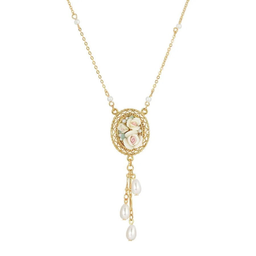 Ivory Rose Filigree Pearl Drop Necklace featuring ivory rose cameo pendant, delicate gold-tone filigree frame, and elegant pearl drop accents with romantic vintage-inspired style