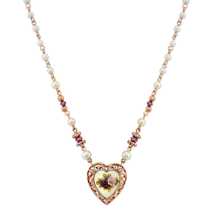Rosalie Victorian Rose Heart Pendant Necklace front view featuring a rose gold-tone filigree heart pendant with floral artwork, faux pearl chain accents, and romantic Victorian charm