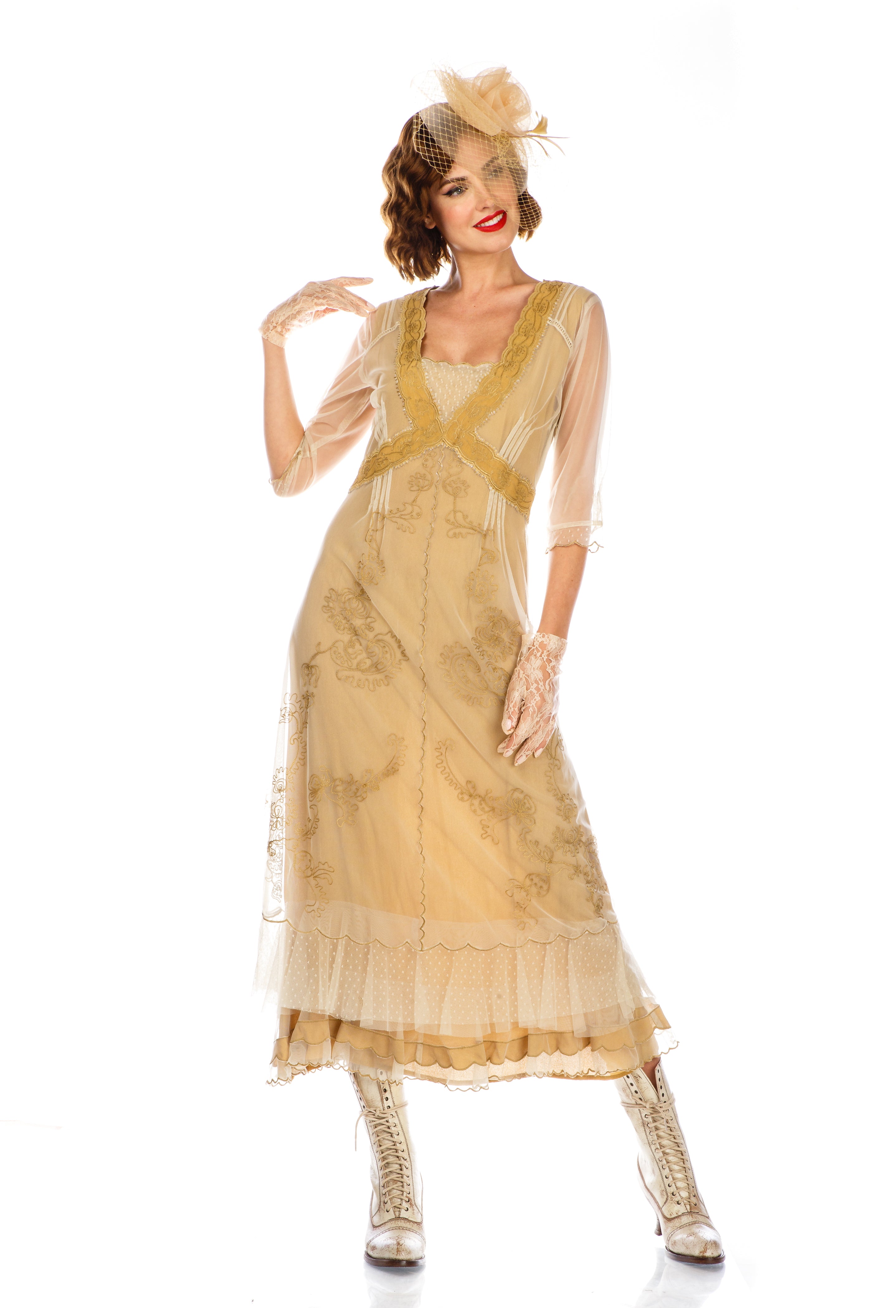 model wearing a Vintage Titanic-Style Dress in Gold by Nataya with matching hatinator